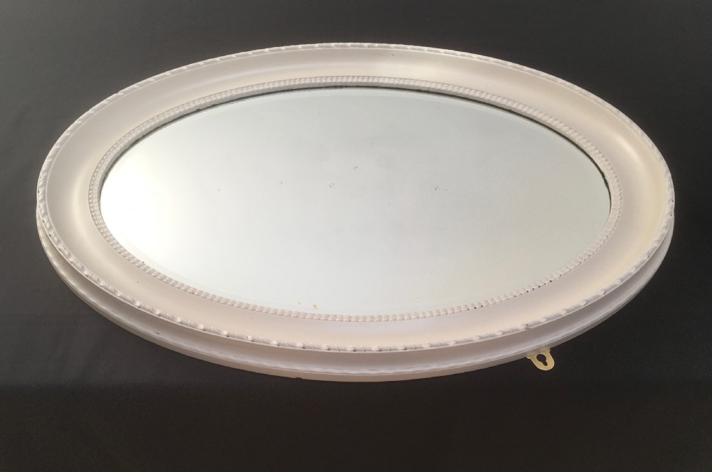 large oval bevelled wall mirror