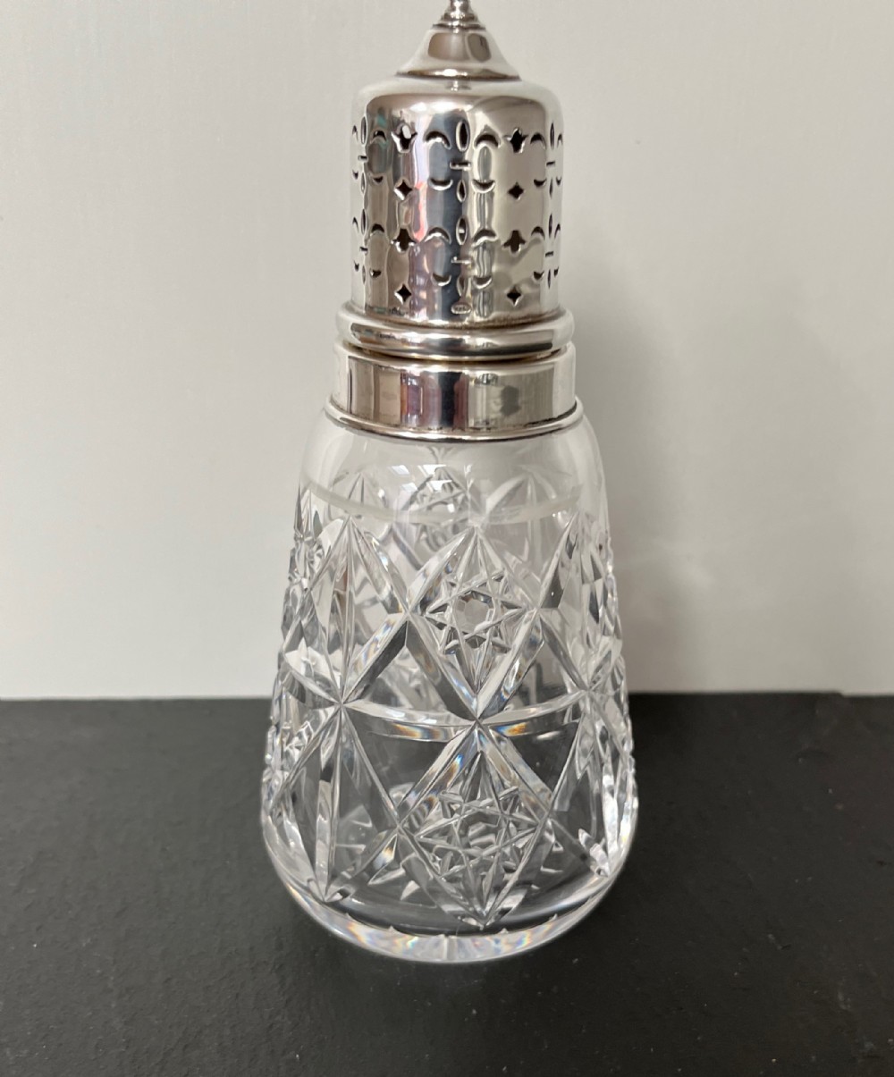 cut glass sugar sifter with silver top
