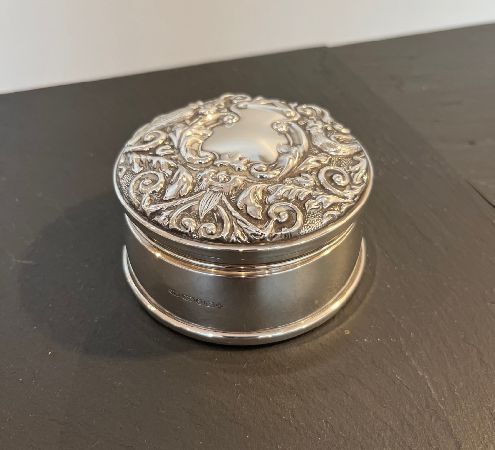 round silver embossed jewellery case